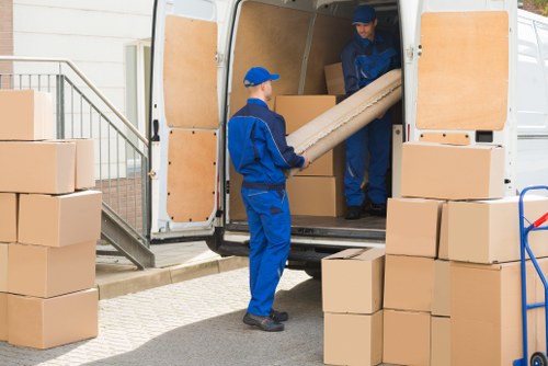 Professional house removalists loading moving boxes in Shepherdsbush