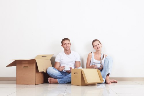 Removal team carrying furniture during a Shepherdsbush home move