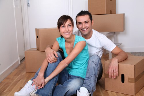 Professional team handling sofa and chair collection in Shepherdsbush