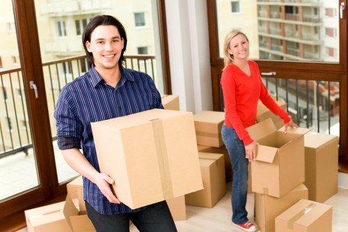 Business relocation team organising office furniture in Shepherdsbush